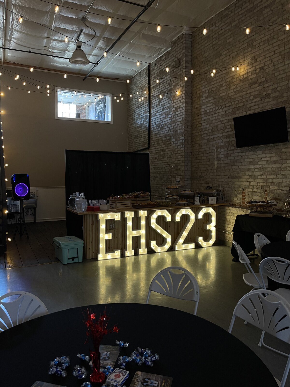 EHS23 marquee letters, buffet spread and round tables set for an Eastmont High School graduation party at Host Wenatchee