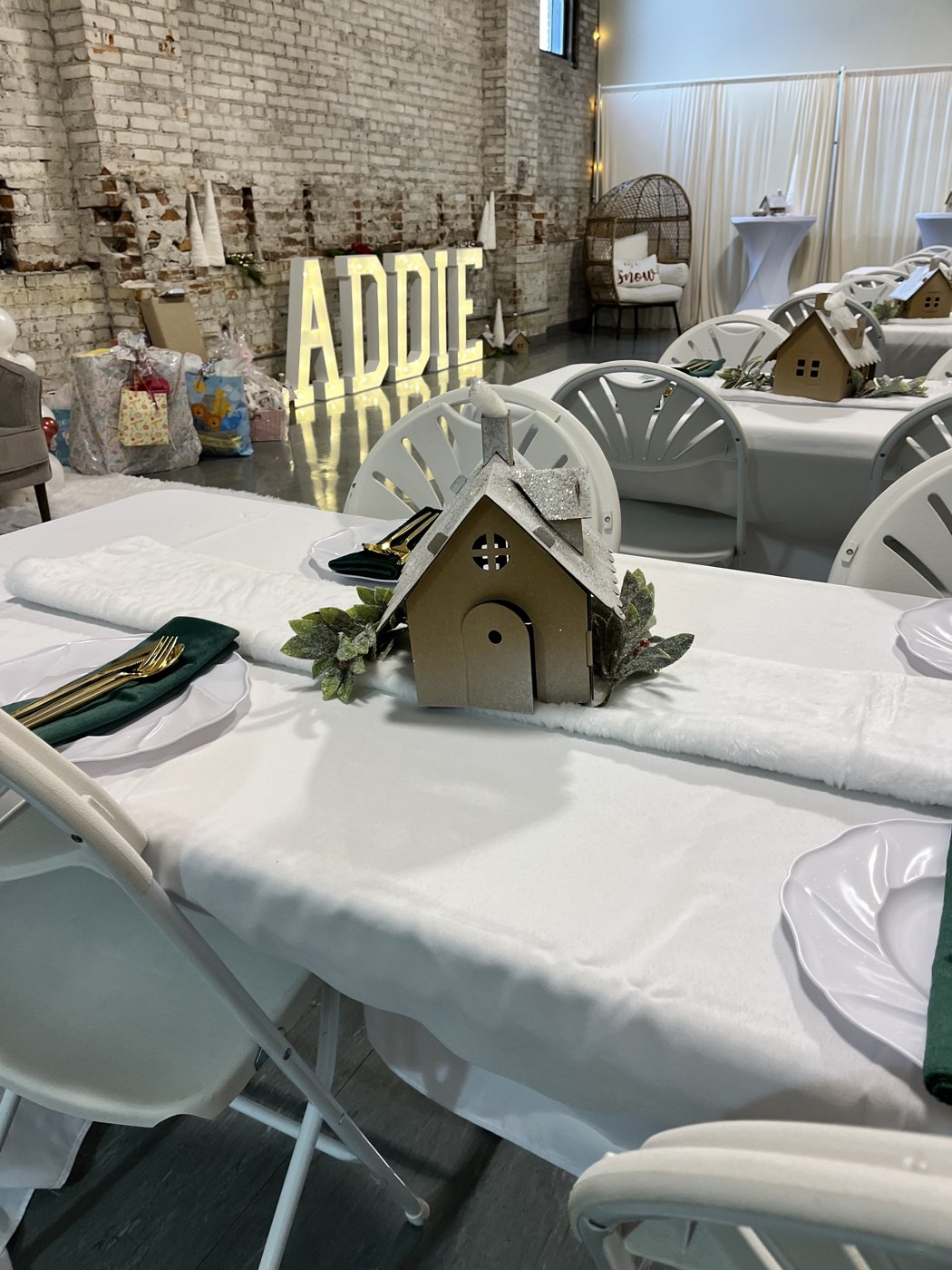 Glowing marquee letters and gingerbread house centerpieces at a Christmas party at Host Wenatchee