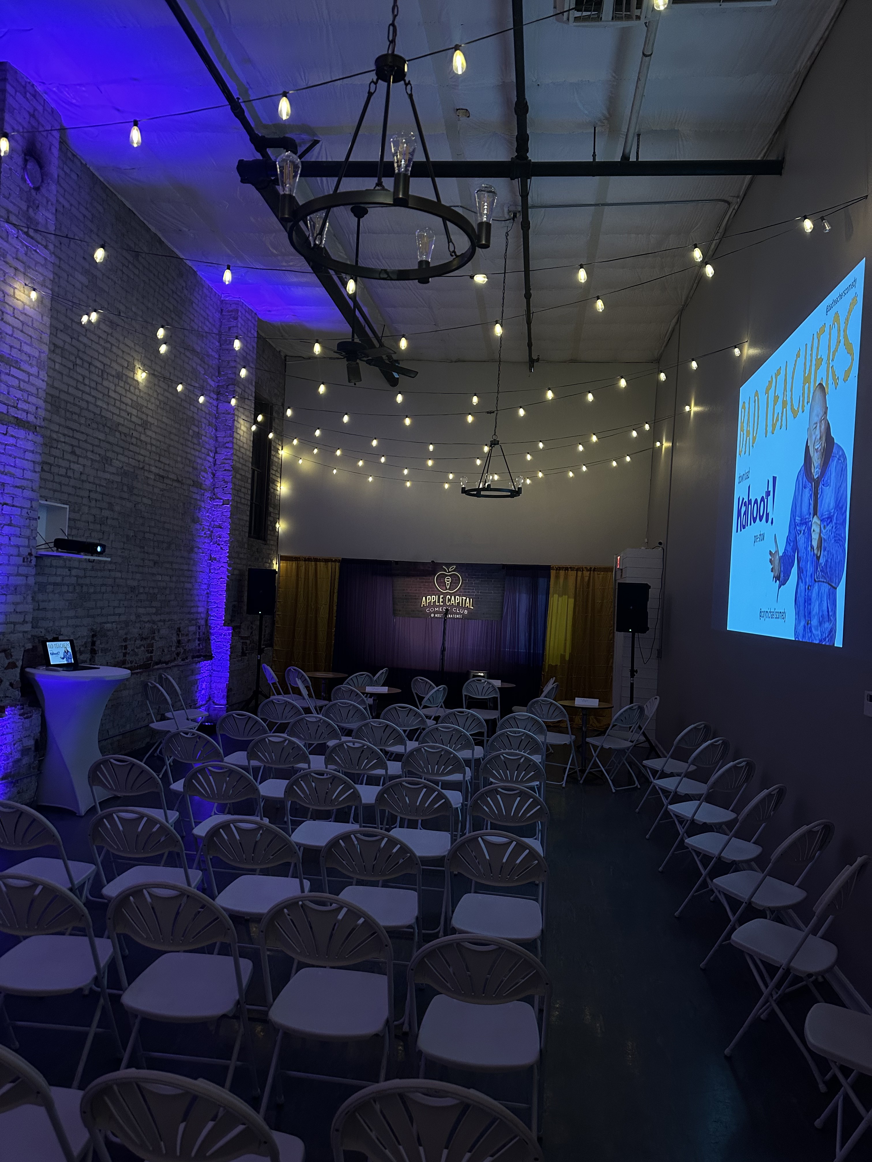 Apple Capital Comedy Club night at Host Wenatchee with theater seating and string lights