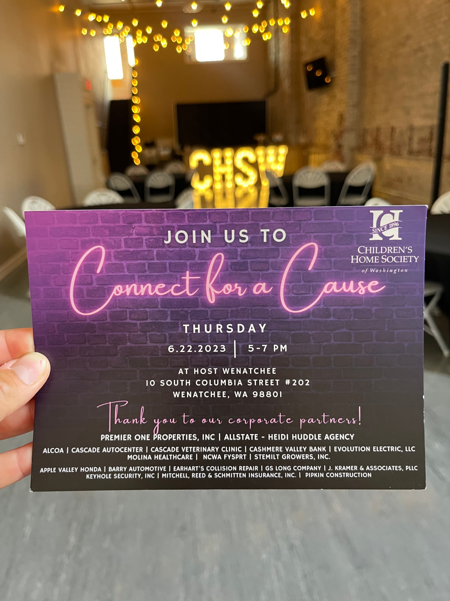 Connect for a Cause invitation for a Children's Home Society of Washington fundraiser held at Host Wenatchee, with CHSW marquee letters glowing behind