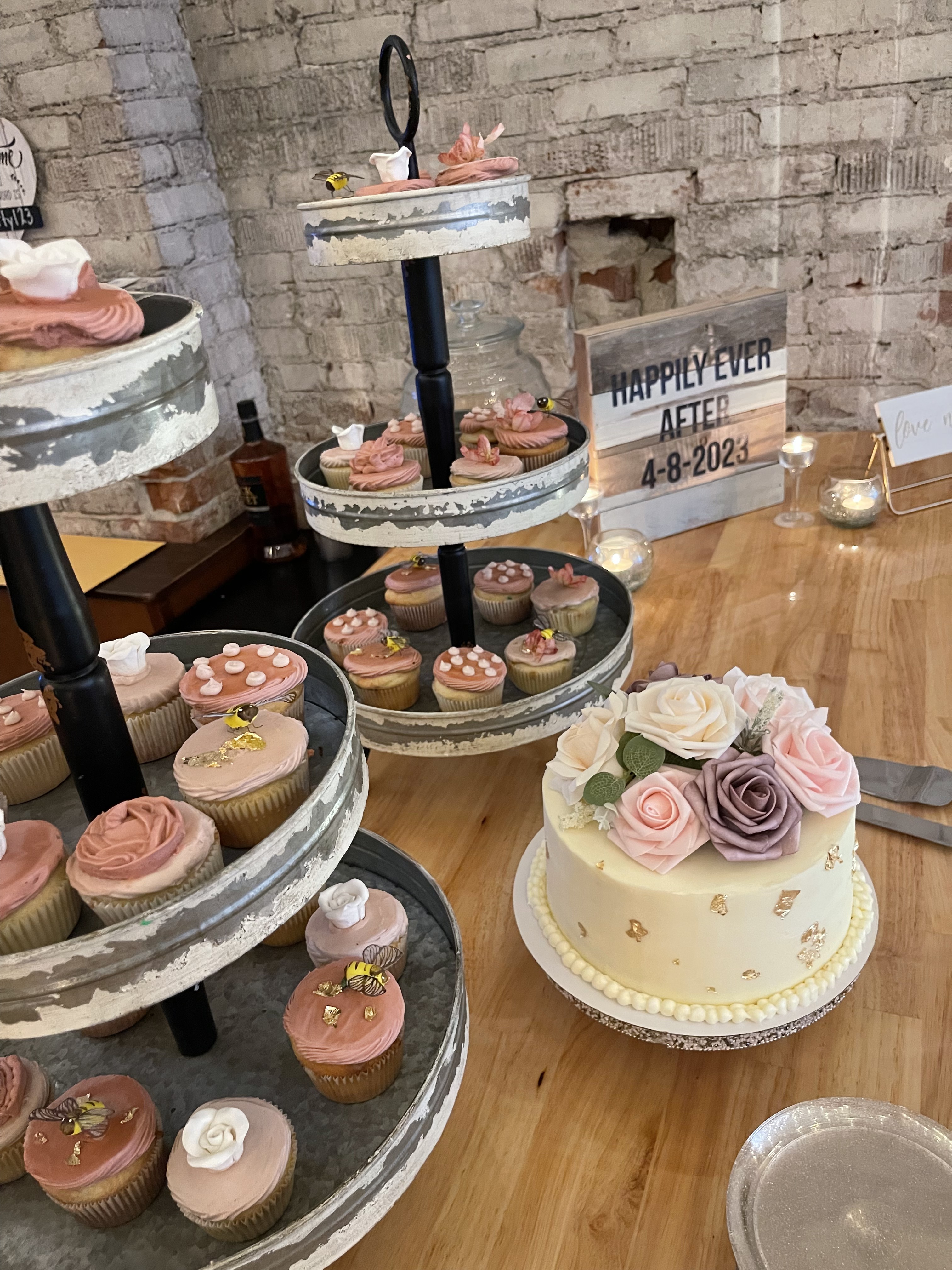 Wedding cupcake dessert display and floral cake on the bar at Host Wenatchee