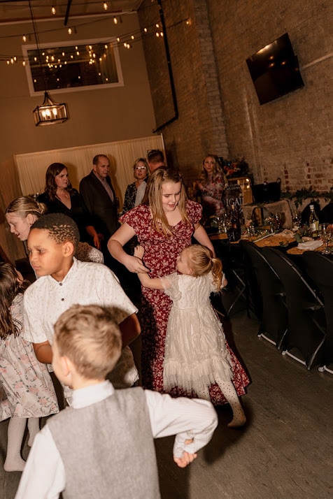 Guests and kids dancing at a winter wedding reception at Host Wenatchee